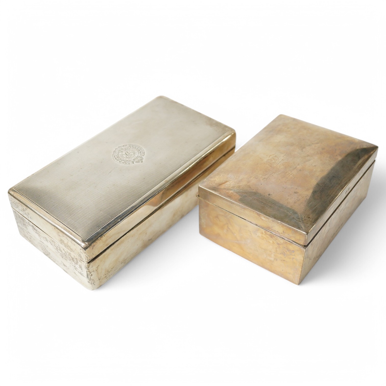 A George VI silver mounted rectangular cigarette box, with engraved Royal Engineers crest, London, 1940, 17.2cm and one other smaller late Victorian silver mounted cigarette box, Birmingham, 1896. Condition - poor to fai